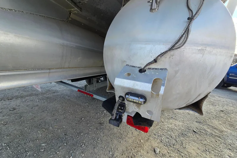 Slide: The Image of Close-up of 2020 Avalon LSZ VRB pontoon boat's underside and trailer hitch. - 17