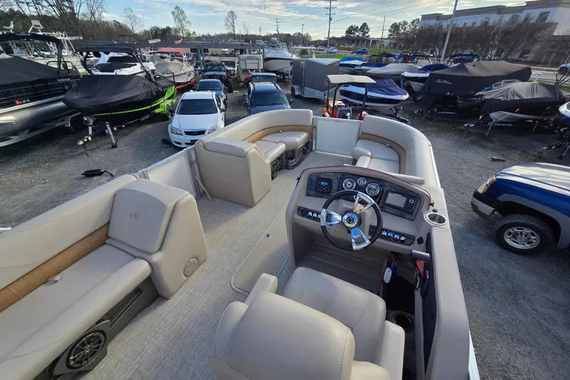 Slide: The Image of 2020 Avalon LSZ VRB 24' pontoon boat interior with steering console and seating. - 22