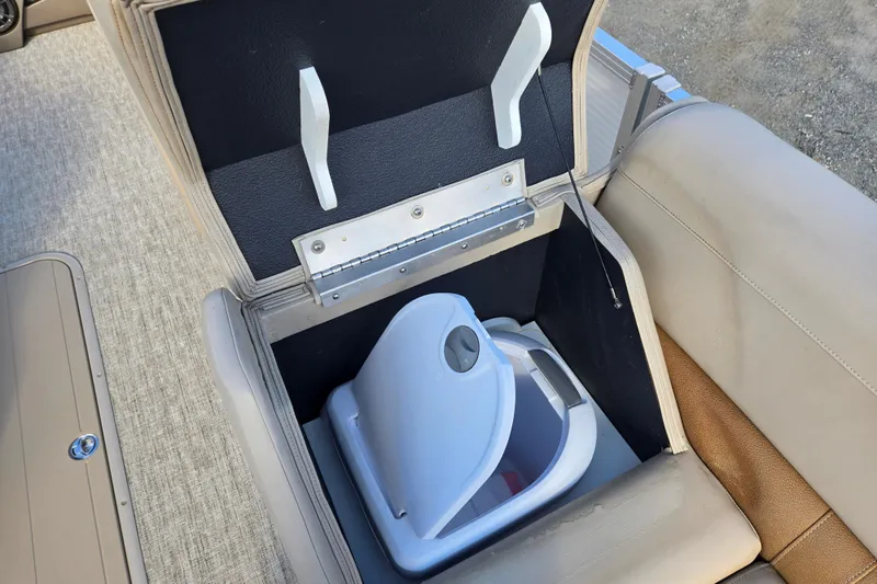 Slide: The Image of Storage compartment with a portable toilet on a 2020 Avalon LSZ VRB - 24' boat. - 31