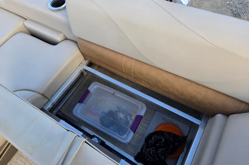 Slide: The Image of Storage compartment in 2020 Avalon LSZ VRB - 24' boat with beige seating. - 36