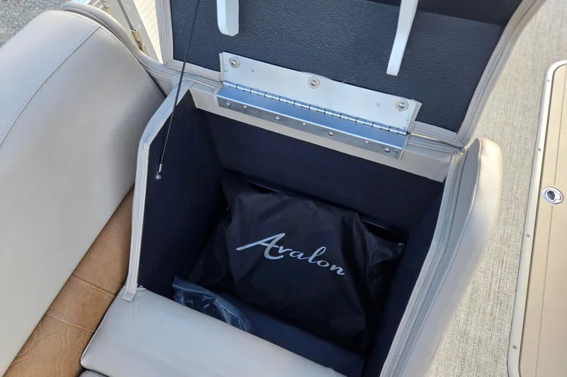 Slide: The Image of Storage compartment in 2020 Avalon LSZ VRB - 24' boat with Avalon-branded bag. - 37