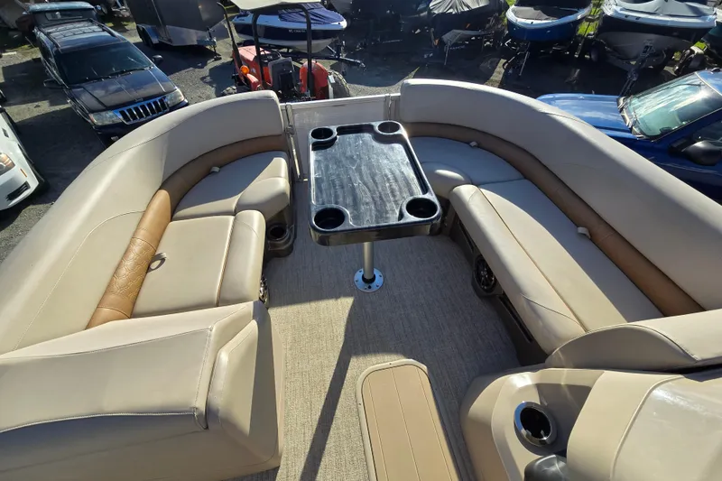Slide: The Image of Luxurious seating area on 2020 Avalon LSZ VRB 24' pontoon boat with table and cup holders. - 47