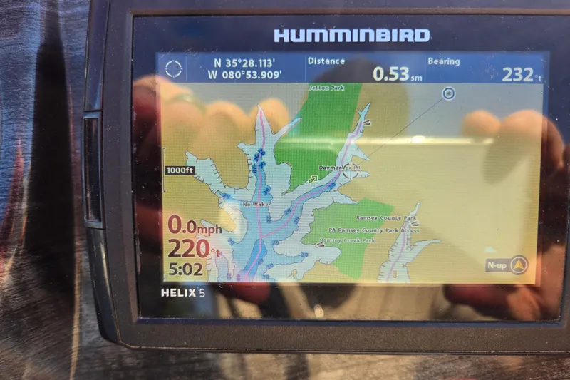 Slide: The Image of Humminbird Helix 5 GPS displaying map and navigation data on Avalon LSZ VRB - 24'. - 50