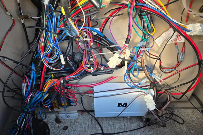 Slide: The Image of Colorful wiring inside a 2020 Avalon LSZ VRB - 24' boat, showcasing electrical components. - 52