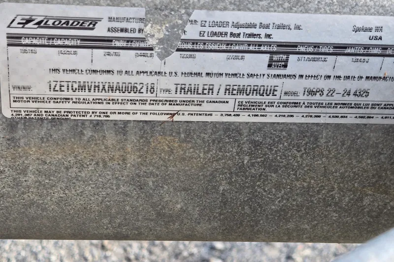 Slide: The Image of Label on EZ Loader trailer, showing compliance and specifications for Avalon LSZ VRB - 24', 2020. - 53