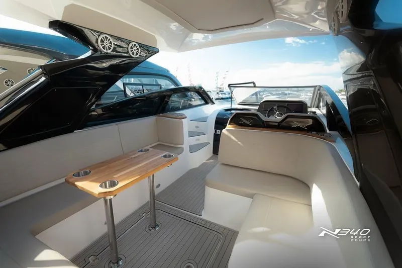 Slide: The Image of Interior of 2026 NX Boats NX340, featuring sleek seating and modern design elements. - 11