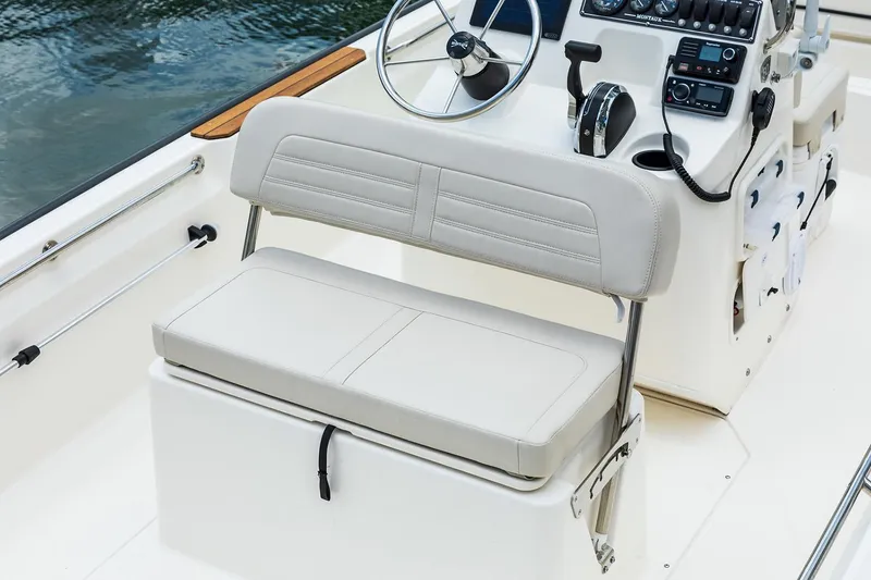 Slide: The Image of Manufacturer Provided Image: 2026 Boston Whaler 170 Montauk boat interior with steering wheel and seating. - 22