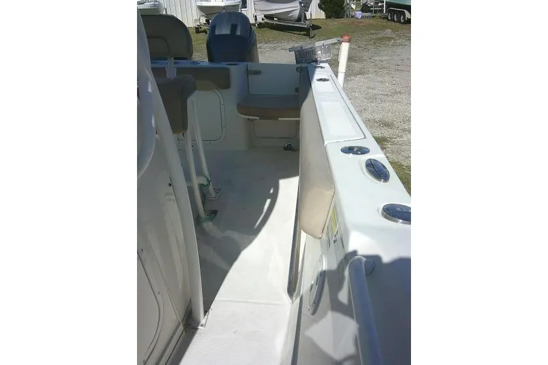 Slide: The Image of 2017 Sailfish 240 CC boat interior with seating and storage compartments. - 19