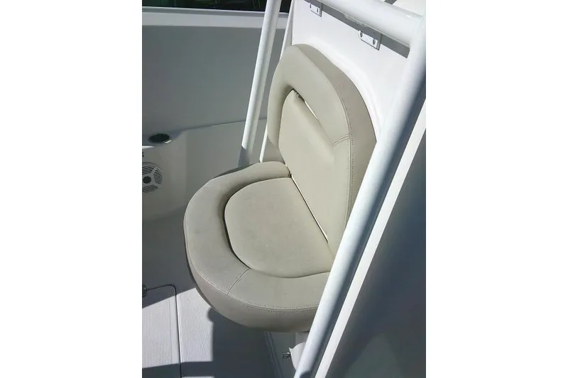 Slide: The Image of Comfortable seating on 2017 Sailfish 240 CC boat, featuring beige upholstery. - 20