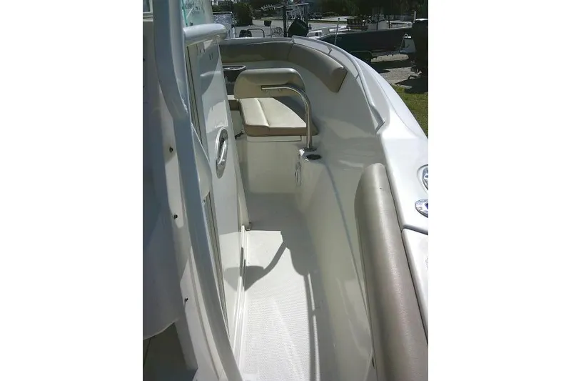 Slide: The Image of 2017 Sailfish 240 CC boat interior with cushioned seating and sleek design. - 27