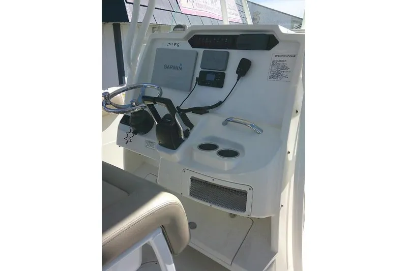 Slide: The Image of Center console of a 2017 Sailfish 240 CC boat with Garmin navigation system. - 28