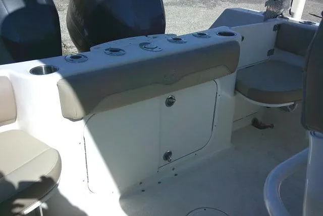 Slide: The Image of 2017 Sailfish 240 CC boat interior with seating and storage compartments. - 34