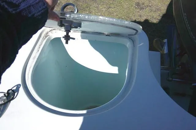 Slide: The Image of Open hatch on 2017 Sailfish 240 CC boat, showing interior compartment. - 35