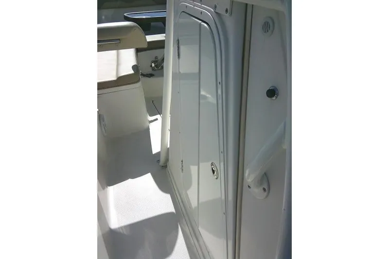 Slide: The Image of Interior view of a 2017 Sailfish 240 CC boat, featuring sleek white surfaces. - 38