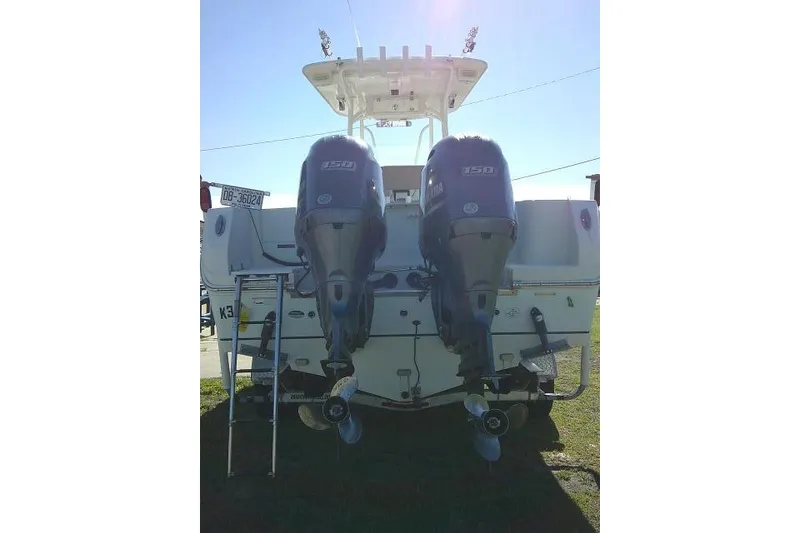 Slide: The Image of 2017 Sailfish 240 CC boat with dual 150 horsepower outboard engines, rear view. - 6