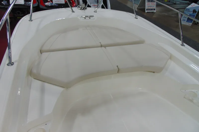 Slide: The Image of 2026 Boston Whaler 170 Montauk boat interior with cushioned seating area. - 11