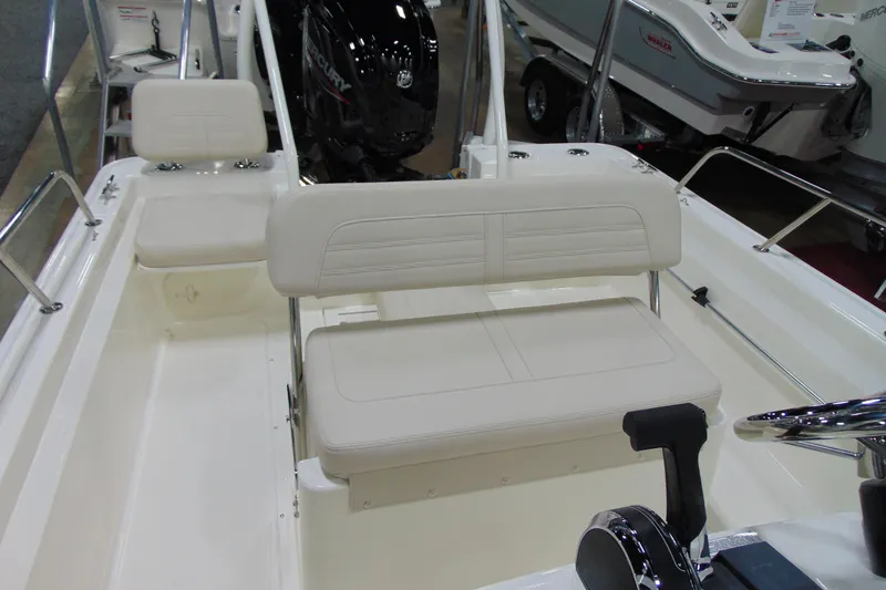 Slide: The Image of 2026 Boston Whaler 170 Montauk boat interior with seating and controls. - 13