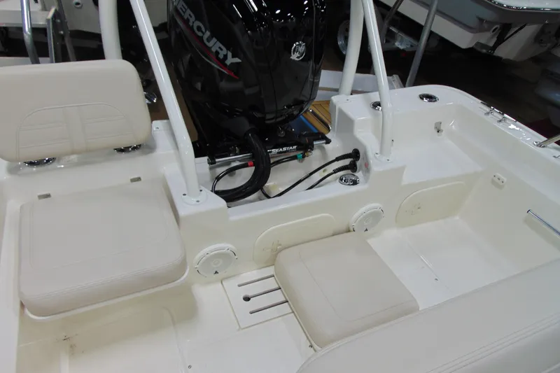 Slide: The Image of 2026 Boston Whaler 170 Montauk boat interior with Mercury engine and seating. - 14