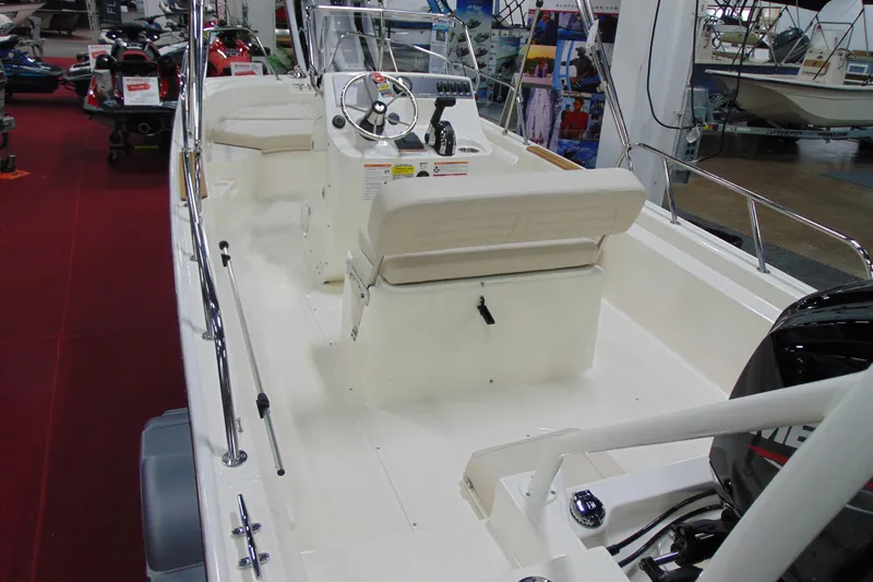 Slide: The Image of 2026 Boston Whaler 170 Montauk boat interior with steering console and seating. - 3