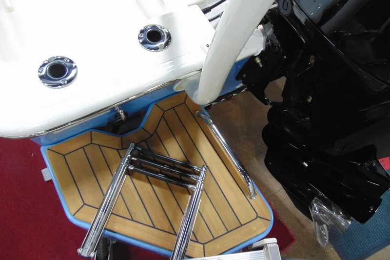 Slide: The Image of Boston Whaler 170 Montauk 2026 boat deck with ladder and motor detail. - 7