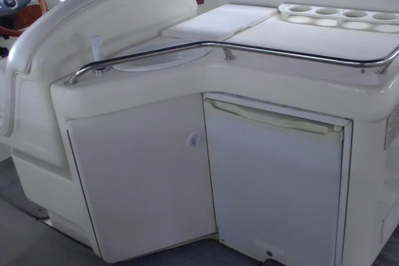 Slide: The Image of Interior view of a 1997 Sea Ray 280 Cuddy Cabin boat kitchenette area. - 5
