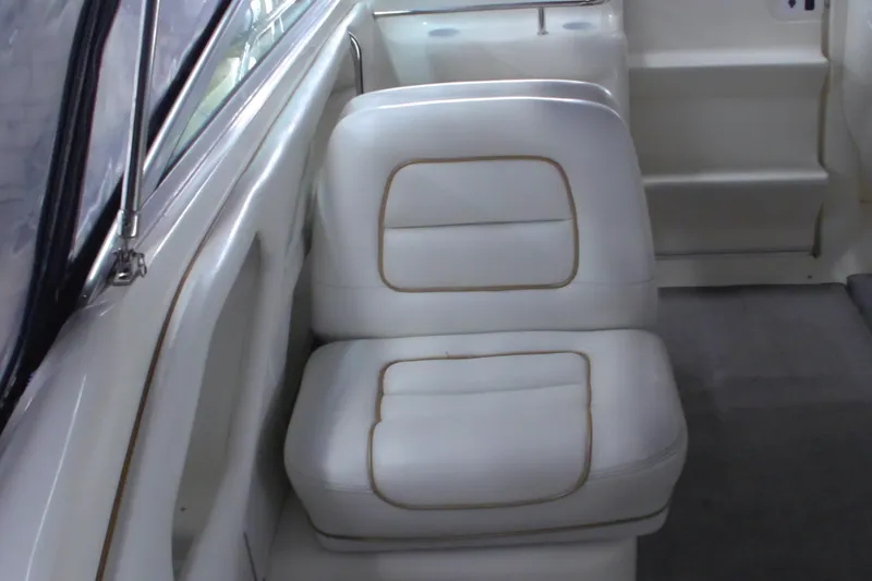 Slide: The Image of White seating inside a 1997 Sea Ray 280 Cuddy Cabin boat. - 7