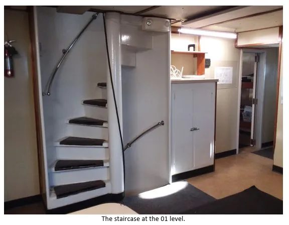 Slide: The Image of Staircase inside 1981 custom lift boat, featuring curved steps and metal railing. - 12