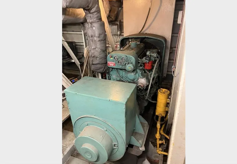 Slide: The Image of Laundry and equipment room on a 1981 custom lift boat, featuring appliances and tools. - 20