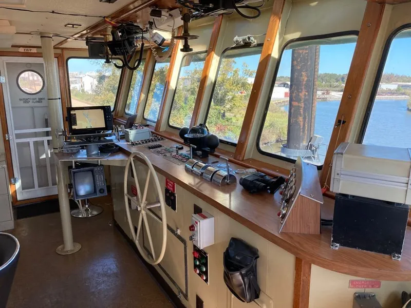 Slide: The Image of Interior of a 1981 custom lift boat's control room with navigation equipment. - 9
