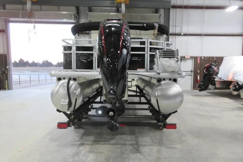 Slide: The Image of 2026 Sun Tracker Fishin' Barge 20 DLX pontoon boat in a warehouse setting. - 5