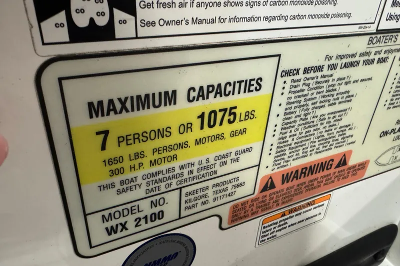 Slide: The Image of Maximum capacity label for 2012 Skeeter WX2100 boat, 7 persons or 1075 lbs. - 12