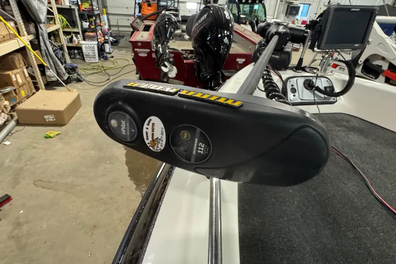 Slide: The Image of Trolling motor on 2012 Skeeter WX2100 boat in a garage setting. - 15