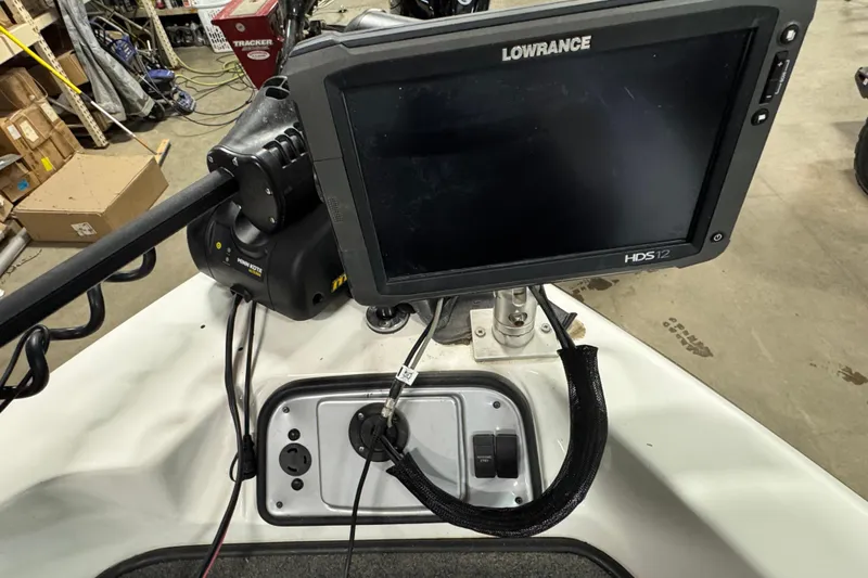 Slide: The Image of Lowrance HDS12 fishfinder on 2012 Skeeter WX2100 boat, in a workshop setting. - 16