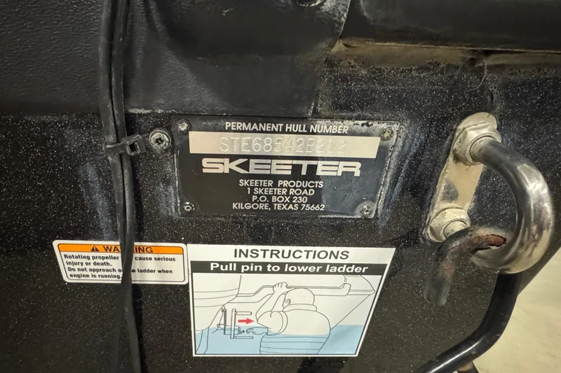 Slide: The Image of Skeeter WX2100 2012 boat hull identification plate with ladder instructions and warning label. - 5