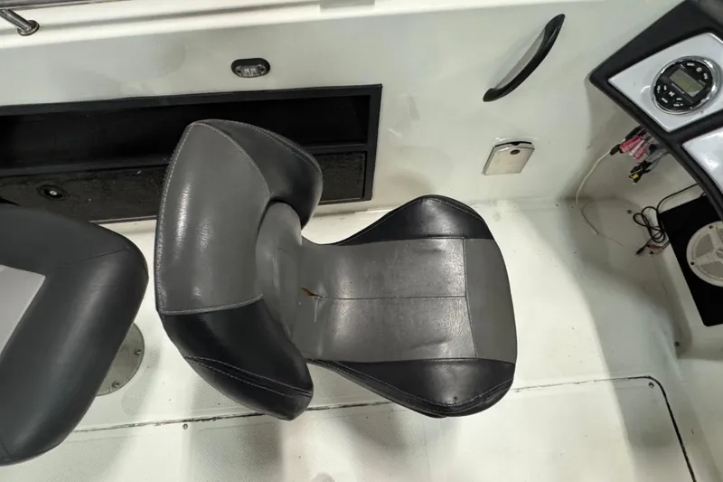 Slide: The Image of Black and gray seat in 2012 Skeeter WX2100 boat interior. - 9