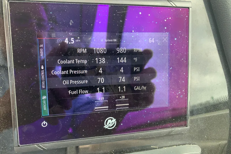 Slide: The Image of Digital display on 2023 Sailfish 276 DC showing engine metrics and performance data. - 13