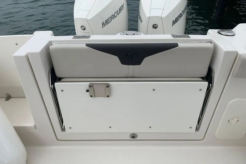 Slide: The Image of 2023 Sailfish 276 DC boat with Mercury engines, featuring a foldable rear seat. - 15