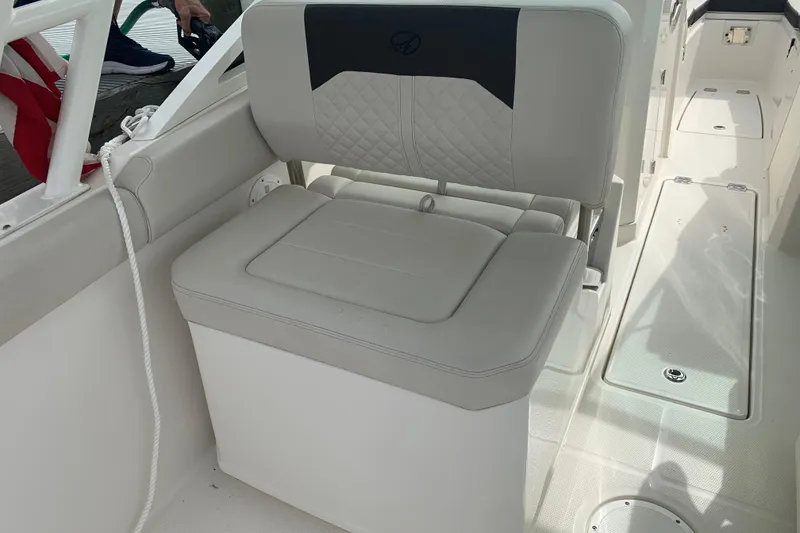Slide: The Image of 2023 Sailfish 276 DC boat seat with quilted design and storage compartment. - 29