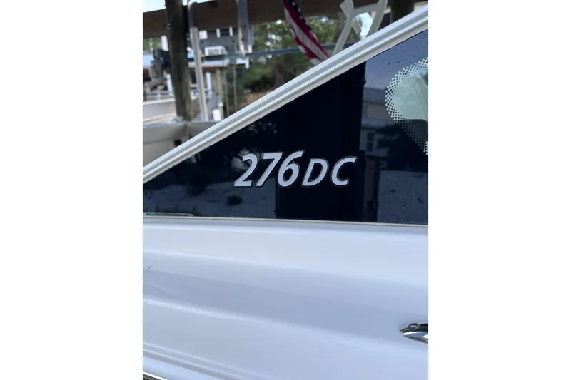Slide: The Image of 2023 Sailfish 276 DC boat model name displayed on side panel. - 3