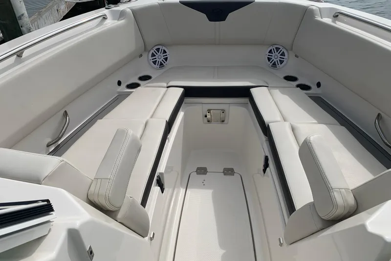 Slide: The Image of Luxurious seating area on 2023 Sailfish 276 DC boat with cup holders and speakers. - 31