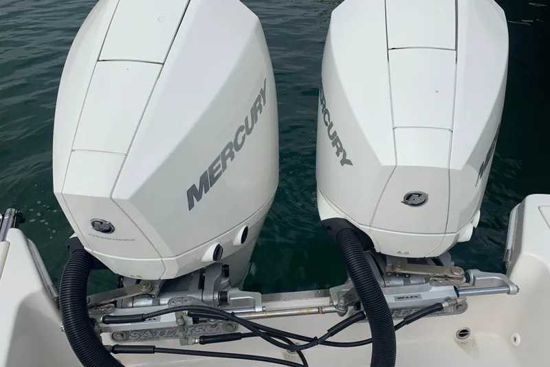 Slide: The Image of Twin Mercury outboard engines on a 2023 Sailfish 276 DC boat. - 34