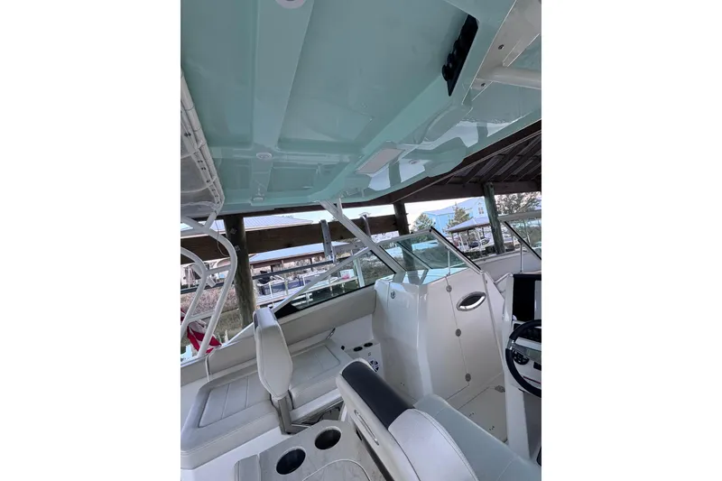 Slide: The Image of 2023 Sailfish 276 DC boat interior with seating and helm, showcasing modern design. - 7