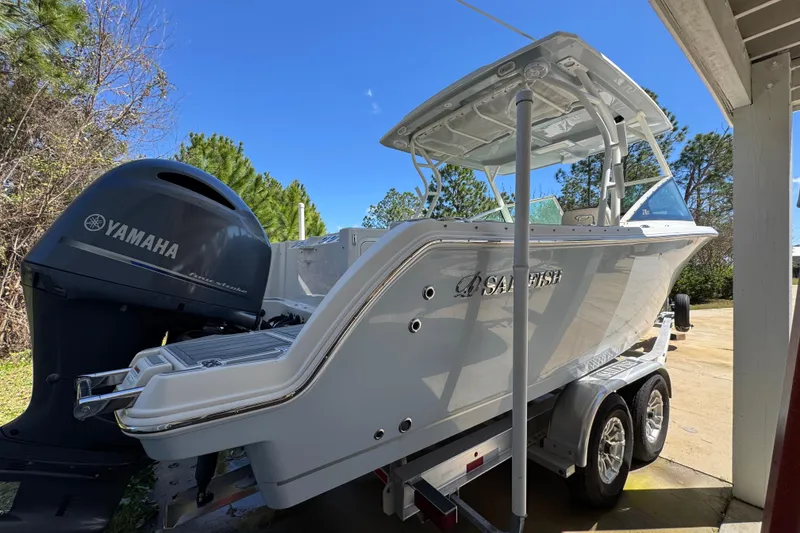 Slide: The Image of 2022 Sailfish 276 DC boat on trailer with Yamaha outboard motor. - 10