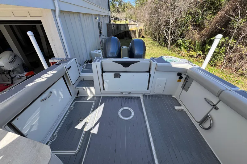 Slide: The Image of 2022 Sailfish 276 DC boat interior with dual engines and spacious deck. - 32