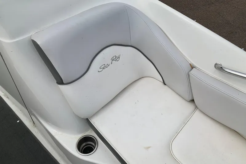 Slide: The Image of White leather seating on a 2012 Sea Ray 200 Sundeck boat. - 14