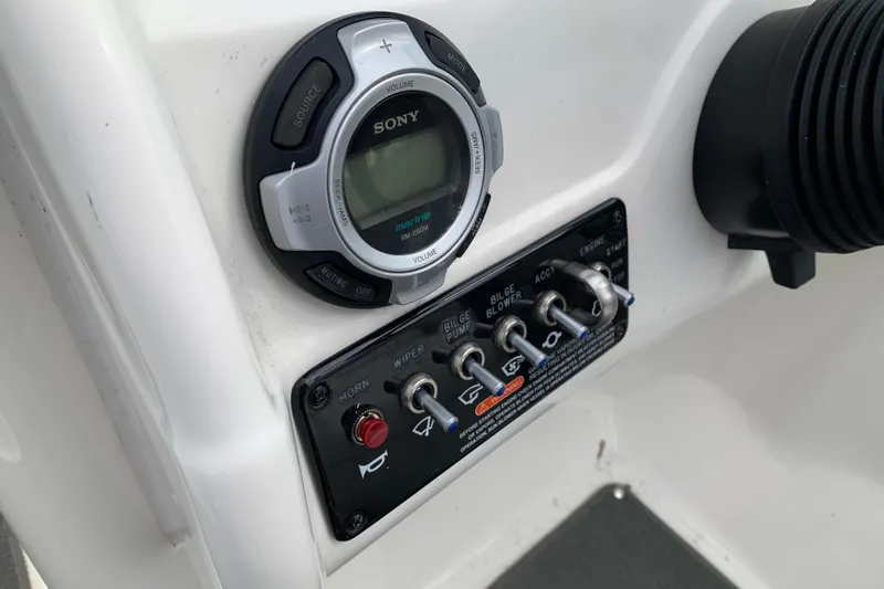 Slide: The Image of Control panel of a 2012 Sea Ray 200 Sundeck with Sony marine audio system. - 18