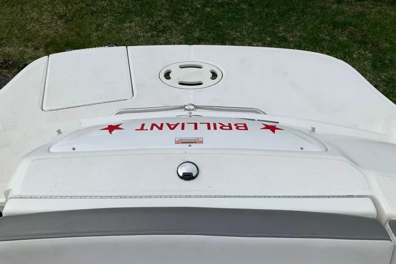 Slide: The Image of 2012 Sea Ray 200 Sundeck boat with "BRILLIANT" text on the deck. - 23