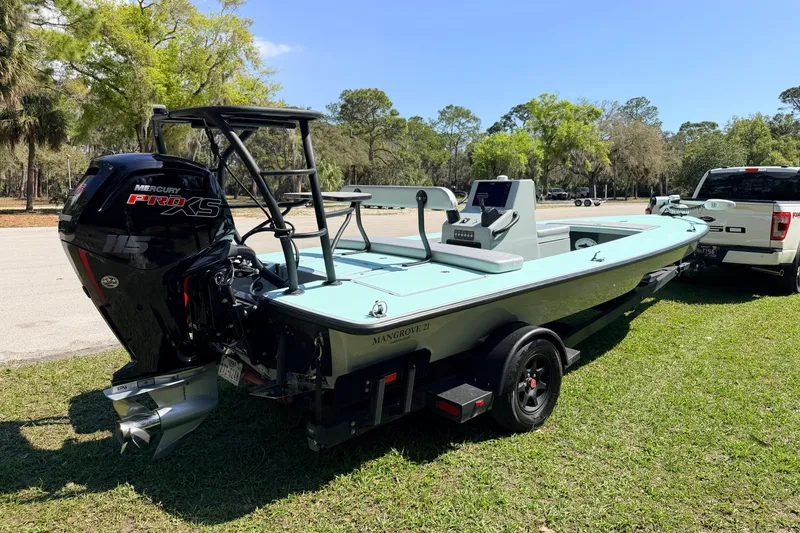 Slide: The Image of 2022 Chittum Skiffs Islamorada 21 boat with Mercury Pro XS engine on trailer. - 2