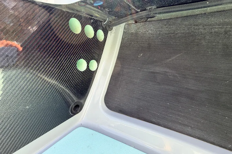 Slide: The Image of Interior detail of 2022 Chittum Skiffs Islamorada 21, featuring carbon fiber paneling. - 20