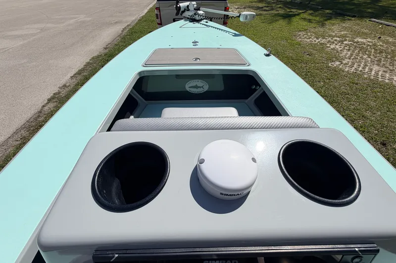 Slide: The Image of 2022 Chittum Skiffs Islamorada 21 boat interior with storage compartments and Simrad equipment. - 28